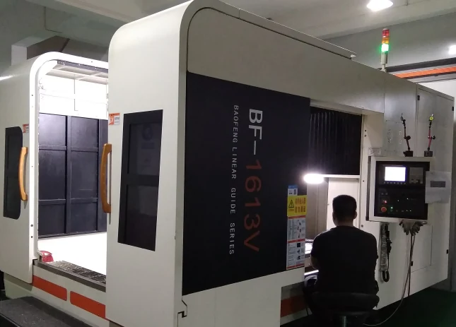 CNC machining center and operator in the KEYMOULD workshop